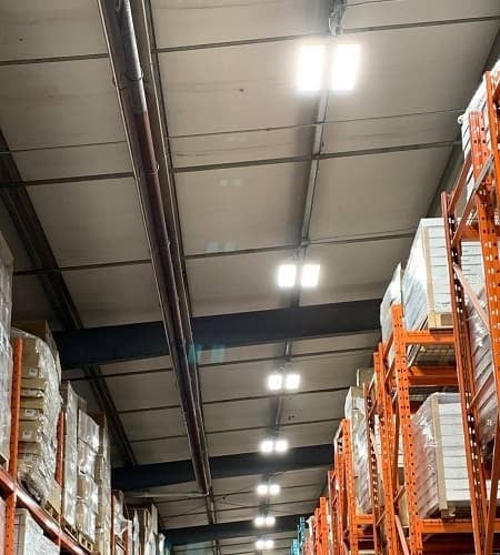 View of a warehouse ceiling with LED lighting.